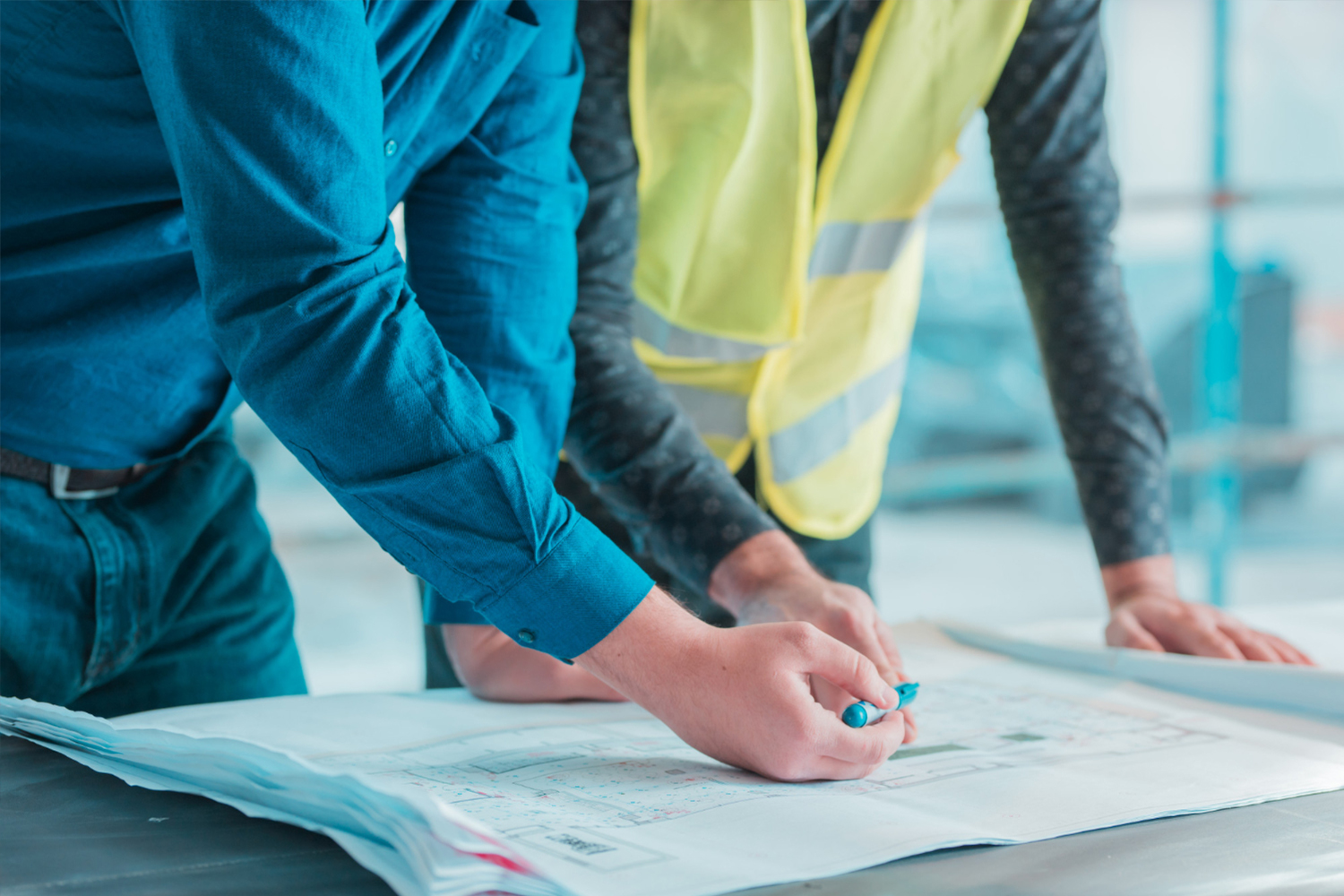 Project managers on site reviewing plans